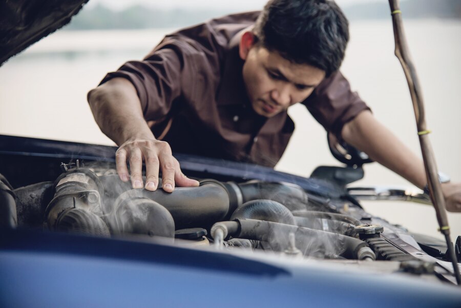 The Top Issues Every BMW Owner Should Know Man-try-fix-car-engine-problem-local-road_1150-10666